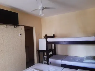 Uma cama ou camas num quarto em Hospedaria Encontro das Águas