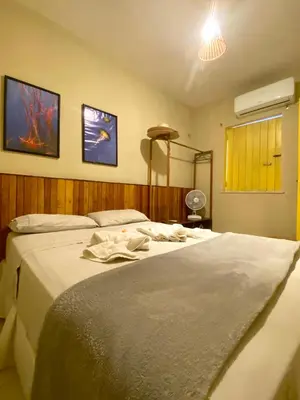 Uma cama ou camas num quarto em Chalés Amarante
