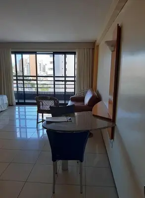 Uma área de estar em Praia Mansa Suite Hotel apto de 1 quarto