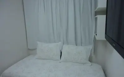 Uma cama ou camas num quarto em Apto à beira-mar com wi-fi e piscina em Fortaleza