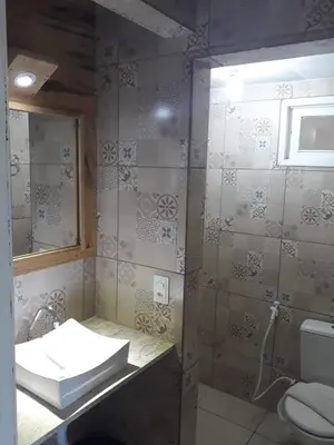 Uma casa de banho em Top Home Pousada