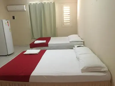 Uma cama ou camas num quarto em Top Home Pousada