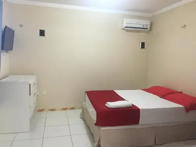Uma cama ou camas num quarto em Top Home Pousada