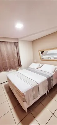 Uma cama ou camas num quarto em Flat da Claudia