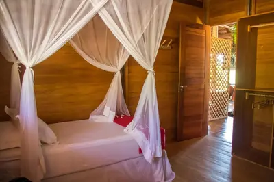 Uma cama ou camas num quarto em Rancho do Kite Villas