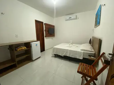 Uma cama ou camas num quarto em Chalés Pulo do Gato
