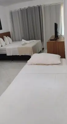 Uma cama ou camas num quarto em Chalés Pulo do Gato