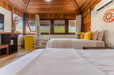 Uma cama ou camas num quarto em Pousada Maxitalia