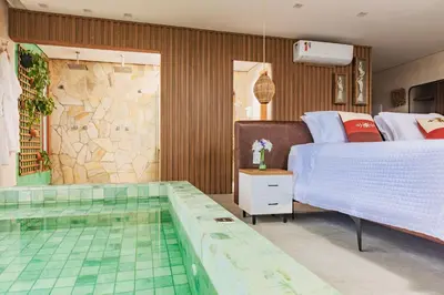Uma cama ou camas num quarto em Pousada Kiriri