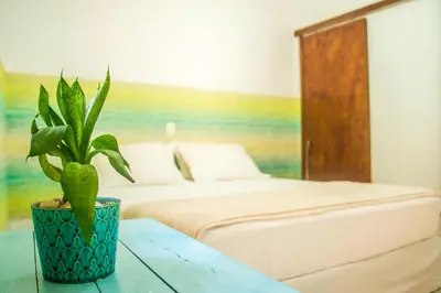 Uma cama ou camas num quarto em A casa é sua!