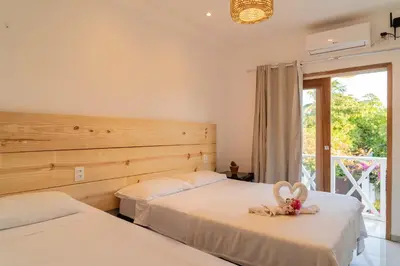 Uma cama ou camas num quarto em Pousada Cactus Jeri