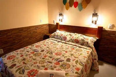 Uma cama ou camas num quarto em Casinha Canoa - Casa Com Ar-Condicionados e Localização Perfeita