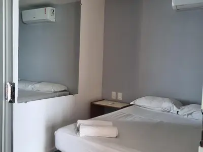 Uma cama ou camas num quarto em Flats Mar Atlântico Residence