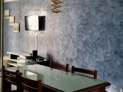 Uma televisão e/ou sistema de entretenimento em Flats Mar Atlântico Residence