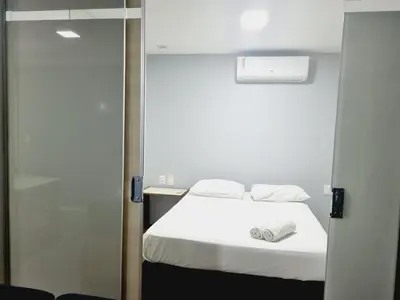 Uma cama ou camas num quarto em Flats Mar Atlântico Residence