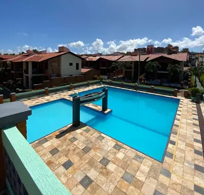 A piscina em ou perto de Linda casa Porto das Dunas: 4 suítes, churrasqueira e piscina