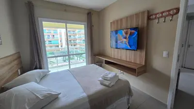 Uma cama ou camas num quarto em JJ ALUGUÉIS TEMPORADA VG FUN PRAIA APT 2 QUARTOS ao lado do hotel Vila Galé