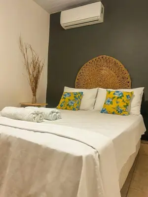 Uma cama ou camas num quarto em Uru Pousada