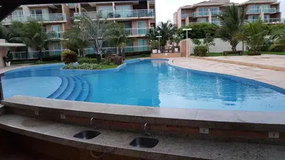A piscina em ou perto de PALM BEACH Porto das Dunas, apartamento todo climatizado TÉRREO a 350 metros Beach Park