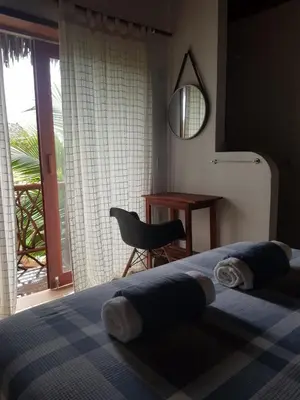 Uma cama ou camas num quarto em Villa Cajuiero Inn