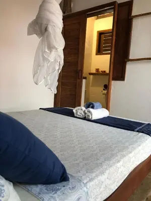 Uma cama ou camas num quarto em Villa Cajuiero Inn