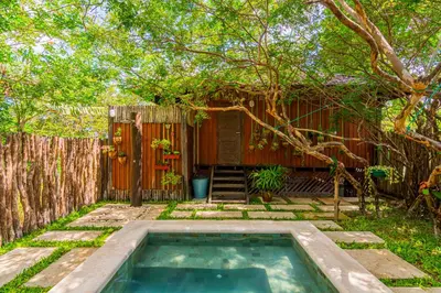 Um jardim no exterior de Villa Papagaio
