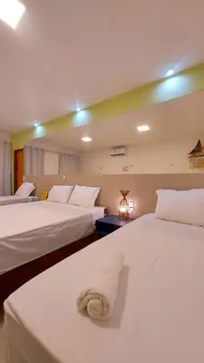 Uma cama ou camas num quarto em Villa Flecheiras