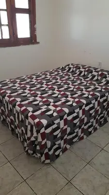 Uma cama ou camas num quarto em Casa de Praia no Morro Branco
