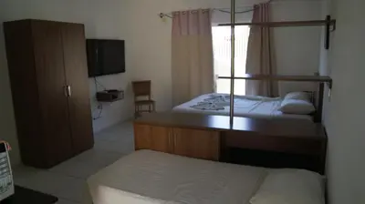 Uma cama ou camas num quarto em Pousada Brisa da Canoa