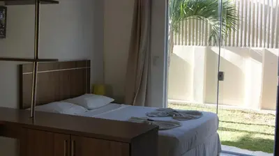 Uma cama ou camas num quarto em Pousada Brisa da Canoa