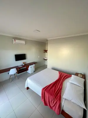 Uma cama ou camas num quarto em Bella Spiaggia Suítes