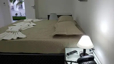 Uma cama ou camas num quarto em LIVE IN FORTALEZA HOTEL