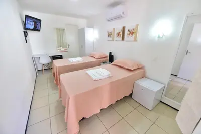Uma cama ou camas num quarto em LIVE IN FORTALEZA HOTEL