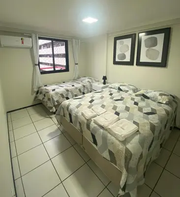 Uma cama ou camas num quarto em Ed. Porto de Iracema com Vista para o Mar
