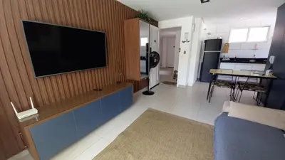 Uma televisão e/ou sistema de entretenimento em Riviera Beach Place - Aquiraz Riviera
