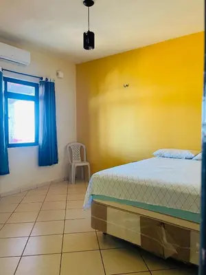 Uma cama ou camas num quarto em Hospedagem da Cleidiane