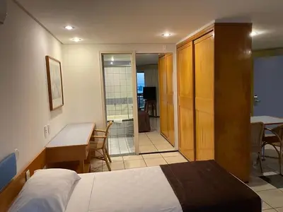 Uma cama ou camas num quarto em Vista espetacular 502 Beira Mar