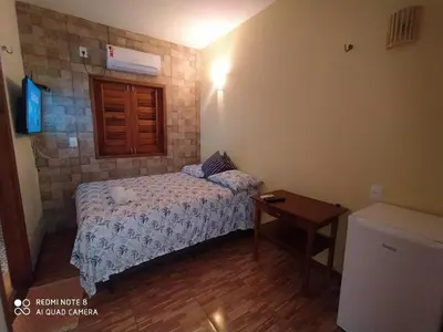 Uma cama ou camas num quarto em Pousada A Casinha
