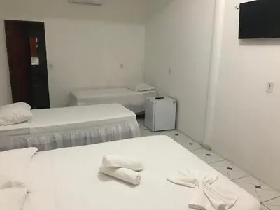 Uma cama ou camas num quarto em Pousada Numei de Jeri