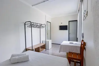 Uma cama ou camas num quarto em Hotel Meireles