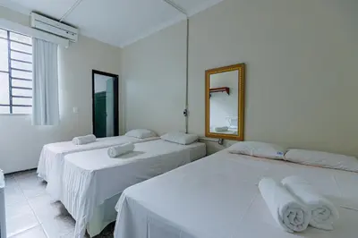 Uma cama ou camas num quarto em Hotel Meireles
