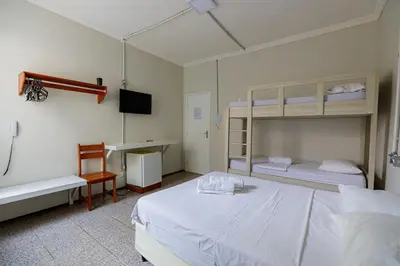 Uma cama ou camas num quarto em Hotel Meireles
