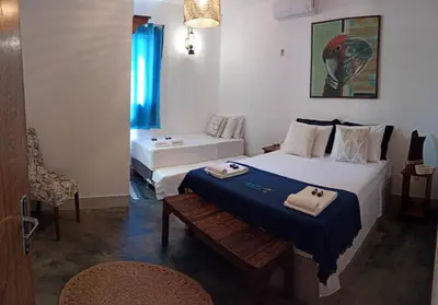 Uma cama ou camas num quarto em Condomínio Shalom Beach