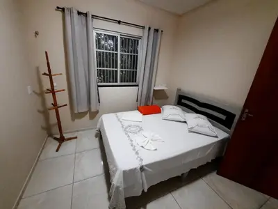 Uma cama ou camas num quarto em Casa Neto&Lu