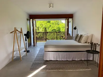 Uma cama ou camas num quarto em Casa Mundaú Tropical Beach Villa