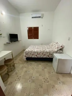 Uma cama ou camas num quarto em Chalé da Kikia