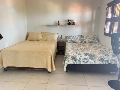 Uma cama ou camas num quarto em Chalé da Kikia