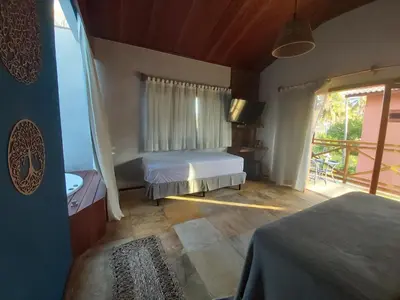 Uma cama ou camas num quarto em Pousada Flor de Lena Icaraizinho - Suíte Jasmim