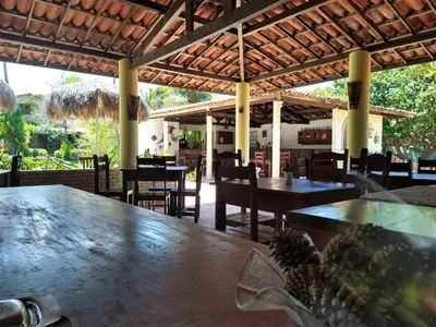 Um restaurante ou outro lugar para comer em Arco Mundial Taíba