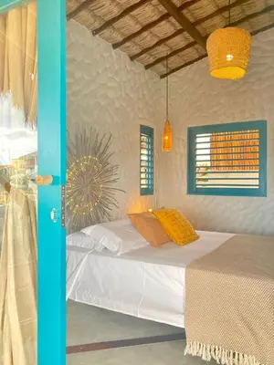 Uma cama ou camas num quarto em Mangará Pousada